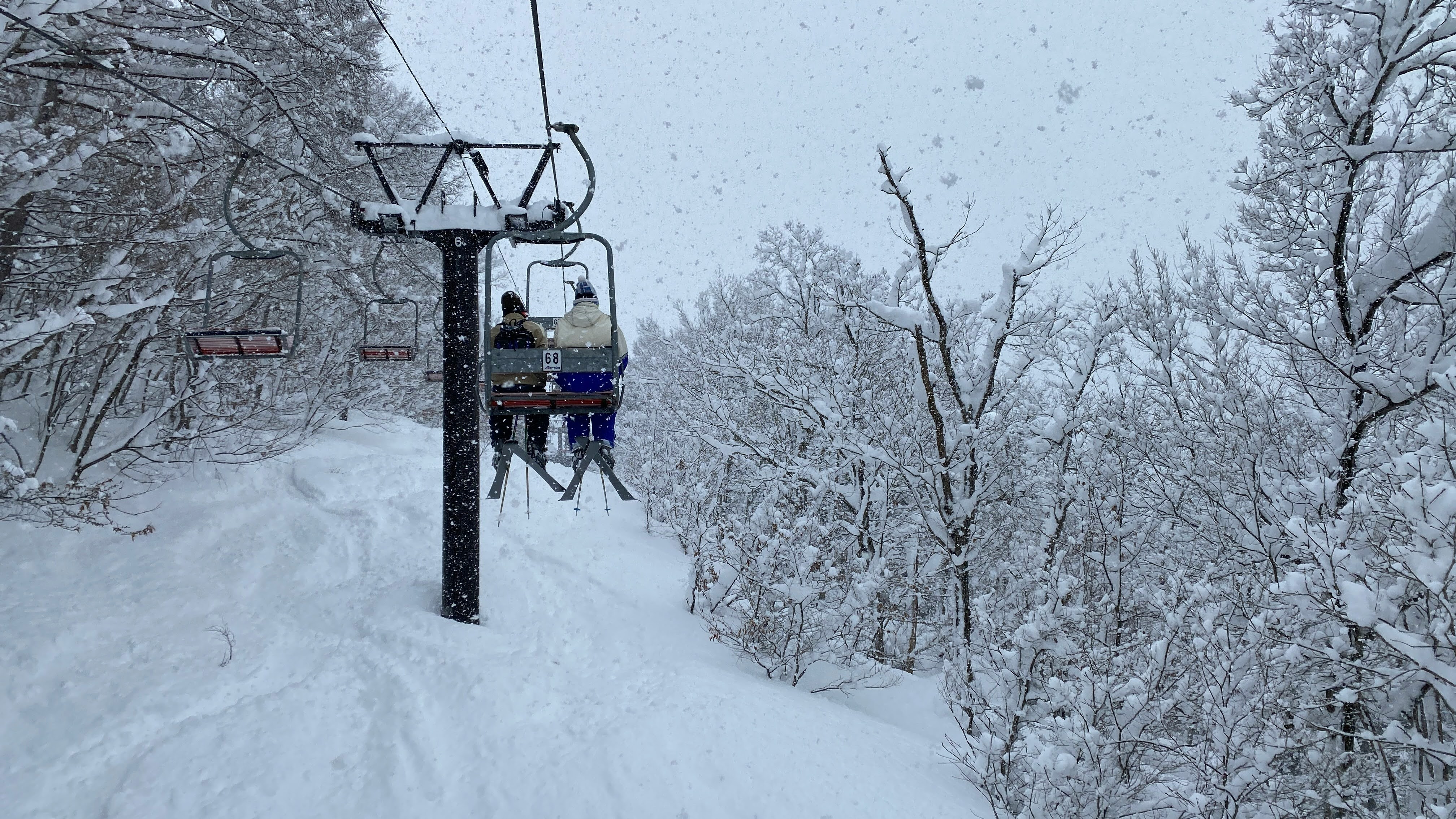Ski lift in heavy snowfall — Japan resort skiing